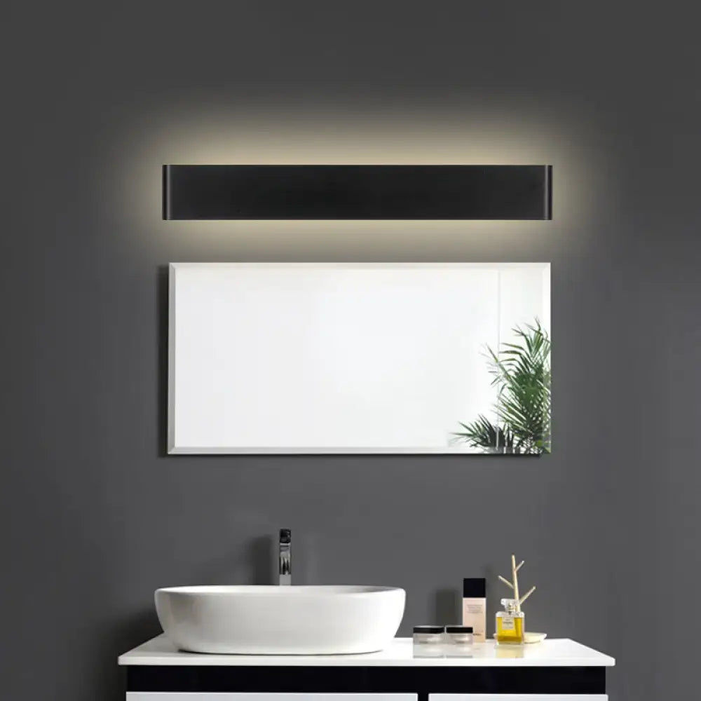 Black LED vanity sconce Decorbites, wall-mounted above a vanity mirror on dark wall on Tampa Home & Garden Store