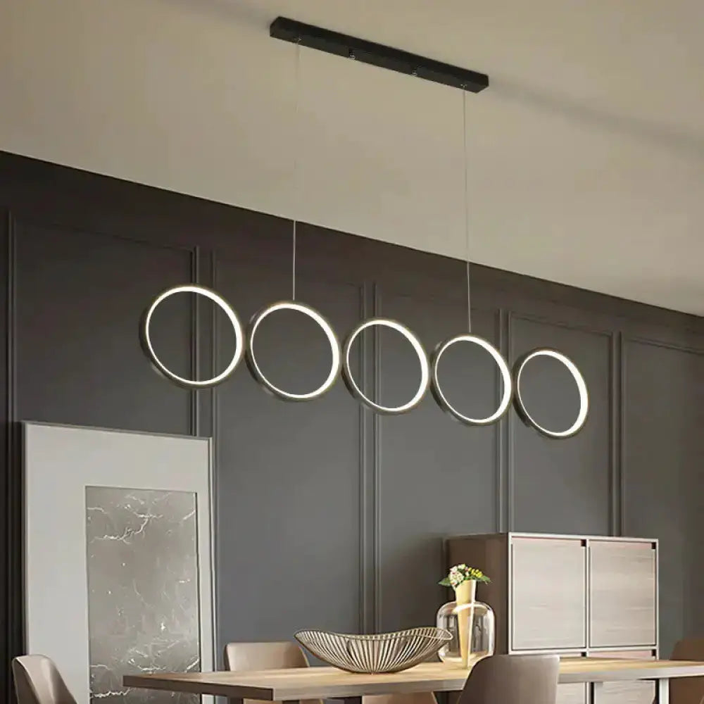 Modern black five-ring LED pendant light for dining room island Decorbites on Tampa Home & Garden Store