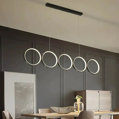 Modern black five-ring LED pendant light for dining room island Decorbites on Tampa Home & Garden Store