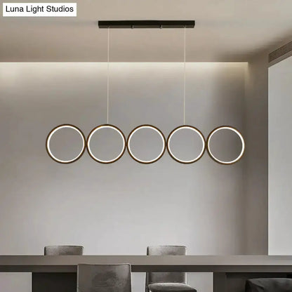 Modern black 5-ring LED pendant light for dining island by Decorbites with circular rings on Tampa Home & Garden Store