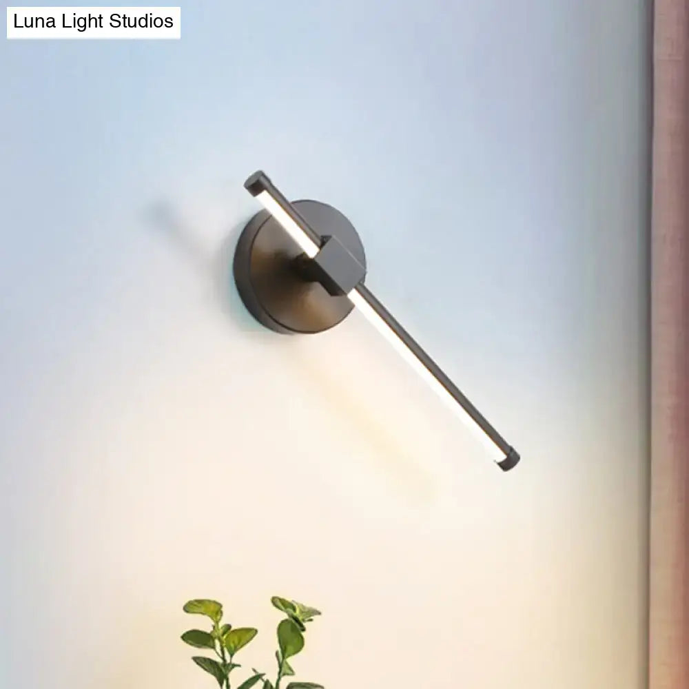 Black acrylic tube wall sconce with circular backplate by Decorbites; Luna Light Studios label on Tampa Home & Garden Store