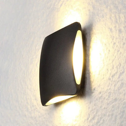 Black Diamond LED Sconce by Decorbites, matte black metal wall light with warm glow on Tampa Home & Garden Store