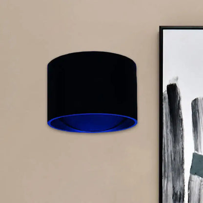 Black Velvet Circle Sconce by Decorbites, wall-mounted with blue inner glow on Tampa Home & Garden Store