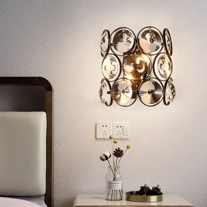Crystal brass wall sconce with circular crystal discs by Decorbites on Tampa Home & Garden Store