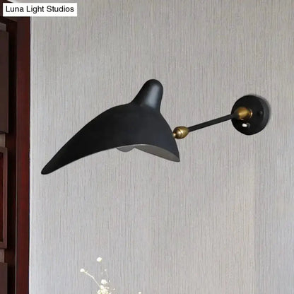 Duckbill wall lamp in black and brass with metallic shade on Tampa Home & Garden Store