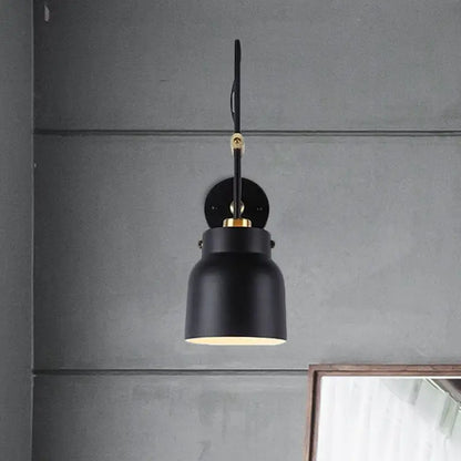 Black brass adjustable dual-voltage wall light by Decorbites with black shade and brass hardware on Tampa Home & Garden Store