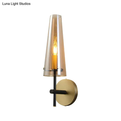 Black brass wall mount sconce with clear glass shade and Edison bulb by Decorbites on Tampa Home & Garden Store