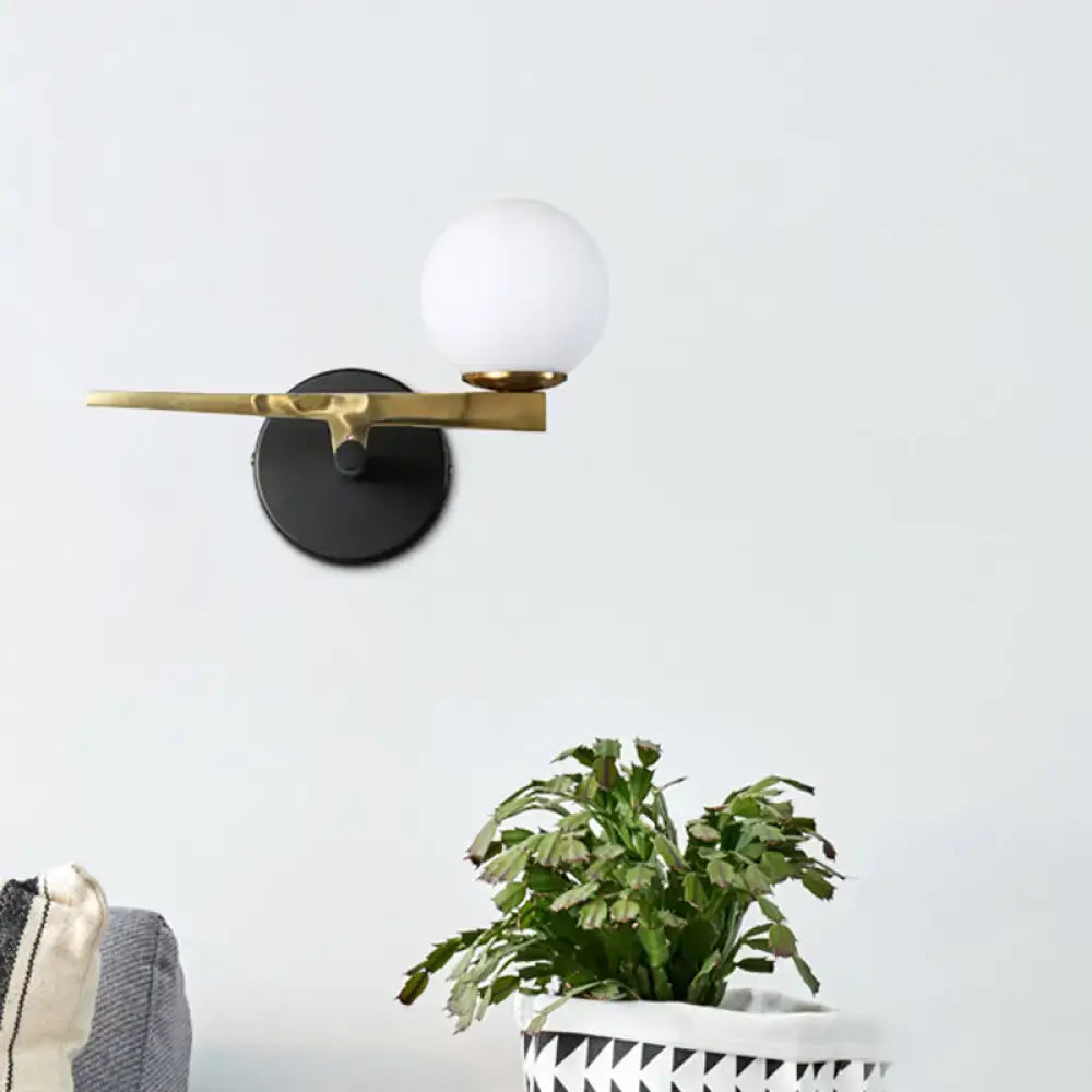 Black White Spherical Glass Sconce by Decorbites with brass arm and black round mount on Tampa Home & Garden Store