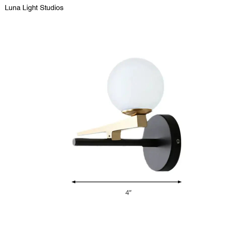 Decorbites black white spherical glass sconce with brass arm and black backplate 4-inch wide on Tampa Home & Garden Store