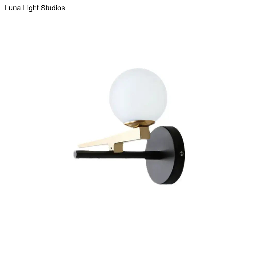 Black White Spherical Glass Sconce with globe, black wall mount and brass accents Decorbites on Tampa Home & Garden Store