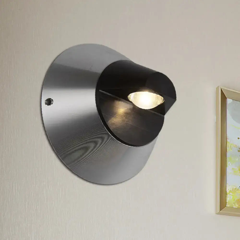Black steel wall sconce by Decorbites with circular backplate and cone shade on Tampa Home & Garden Store