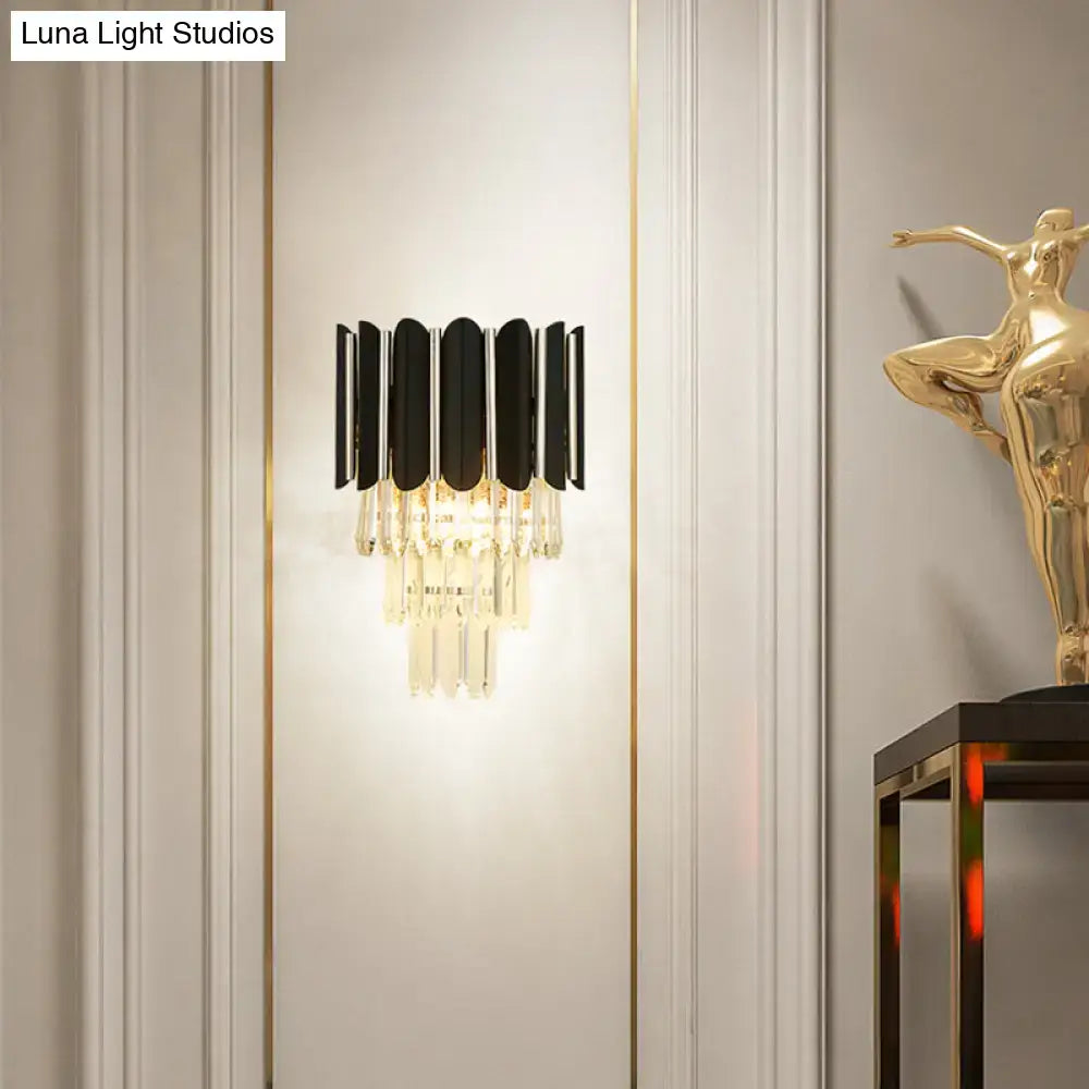 Black crystal tiered wall sconce with black metal arches and hanging prisms Decorbites on Tampa Home & Garden Store