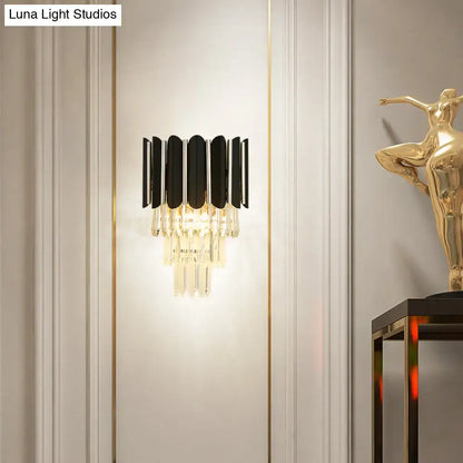 Black crystal tiered wall sconce with black metal arches and hanging prisms Decorbites on Tampa Home & Garden Store