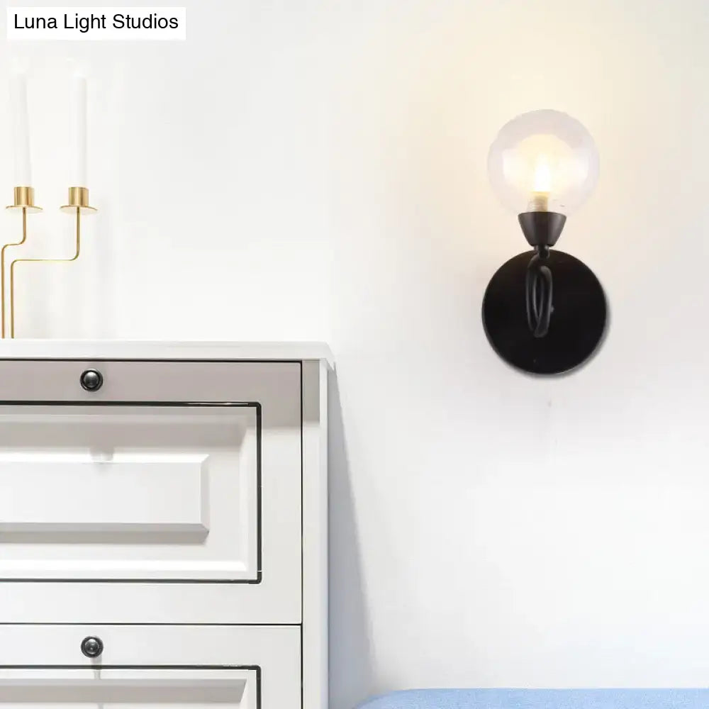 Black clear glass sleek wall lamp by Decorbites on white wall with round black mount on Tampa Home & Garden Store