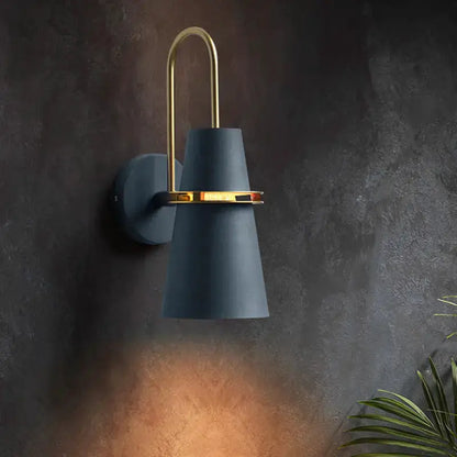 Conical wall sconce in black and gold with brass arch, Decorbites dining room lamp on Tampa Home & Garden Store