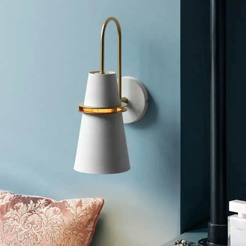 Conical white wall sconce with gold ring and curved brass arm for dining room on Tampa Home & Garden Store