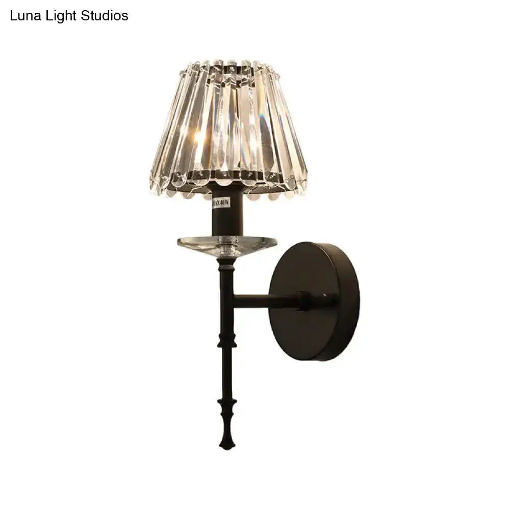 Modern black crystal wall sconce with clear prism shade and round backplate on Tampa Home & Garden Store