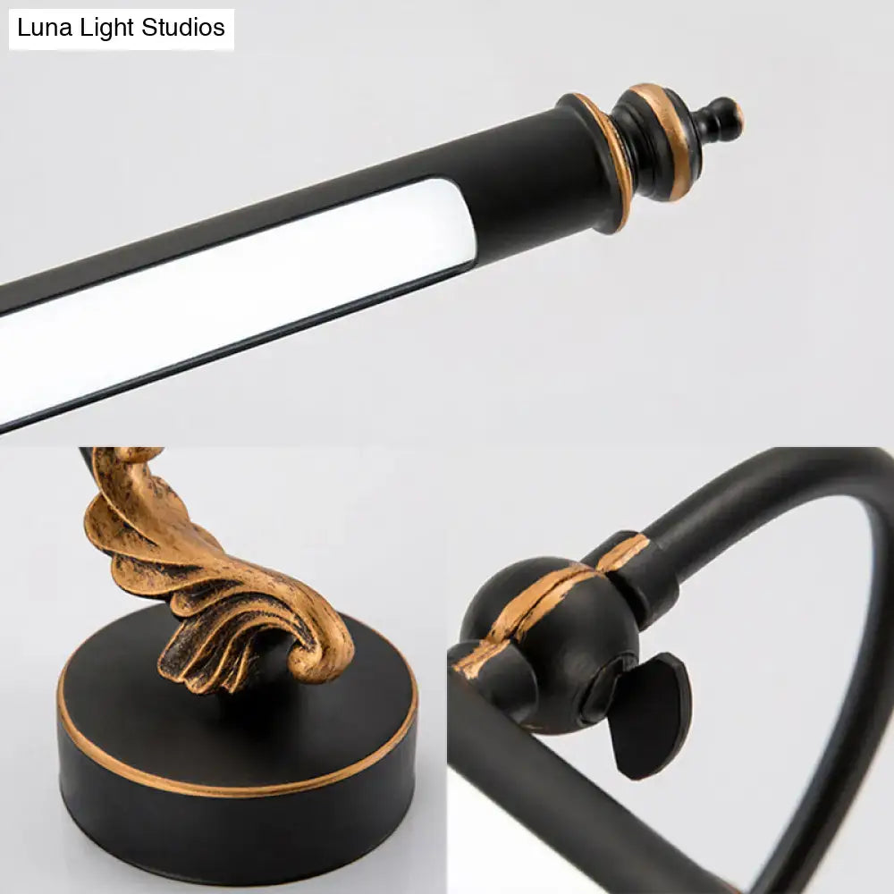 Modern black and gold tubular LED bathroom wall sconce with ornate gold-accent base on Tampa Home & Garden Store