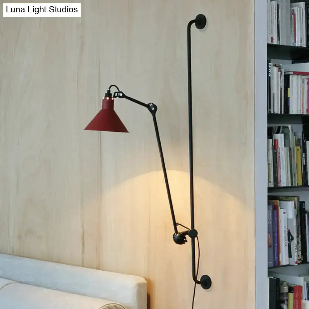 Articulated wall lamp with black metal arm and red cone shade direct wired on Tampa Home & Garden Store