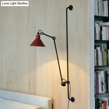 Articulated wall lamp with black metal arm and red cone shade direct wired on Tampa Home & Garden Store