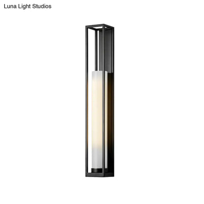 White Glass Tubular Sconce in a black metal frame by Decorbites on Tampa Home & Garden Store