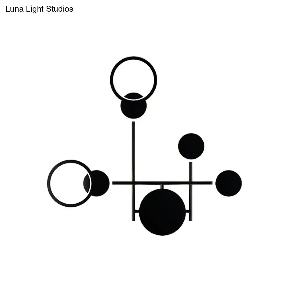 Black metallic wall sconce with geometric rings and discs for a modern sculptural look on Tampa Home & Garden Store