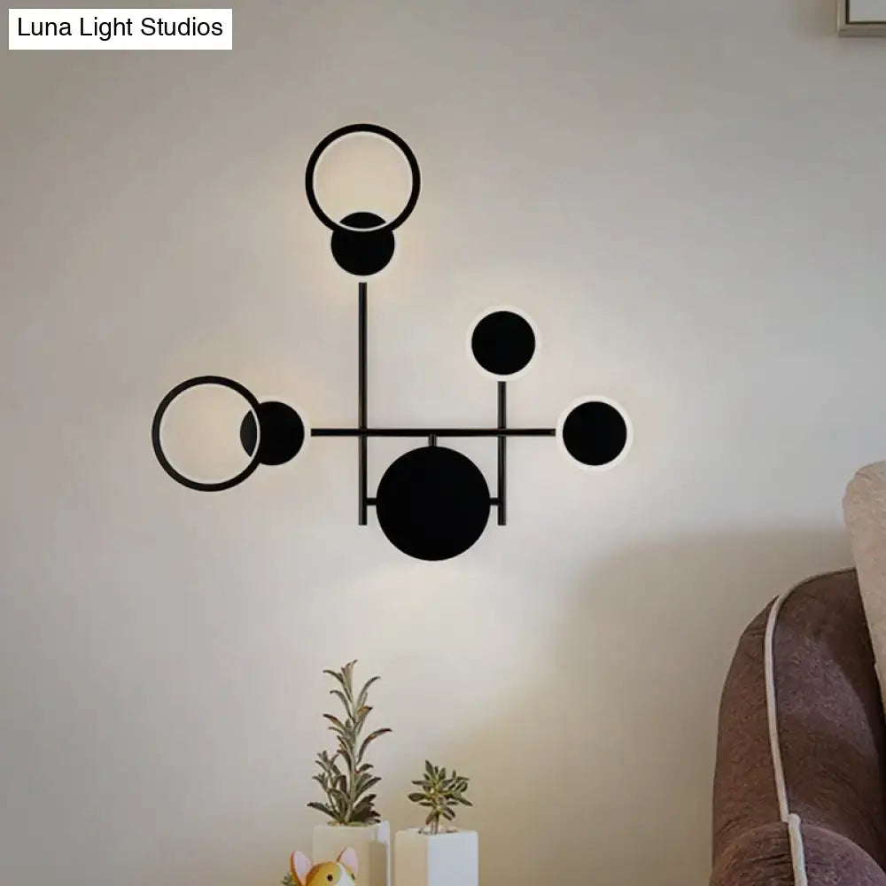 Black Metallic Wall Sconce with circular ring accents, modern geometric metal wall lamp on Tampa Home & Garden Store