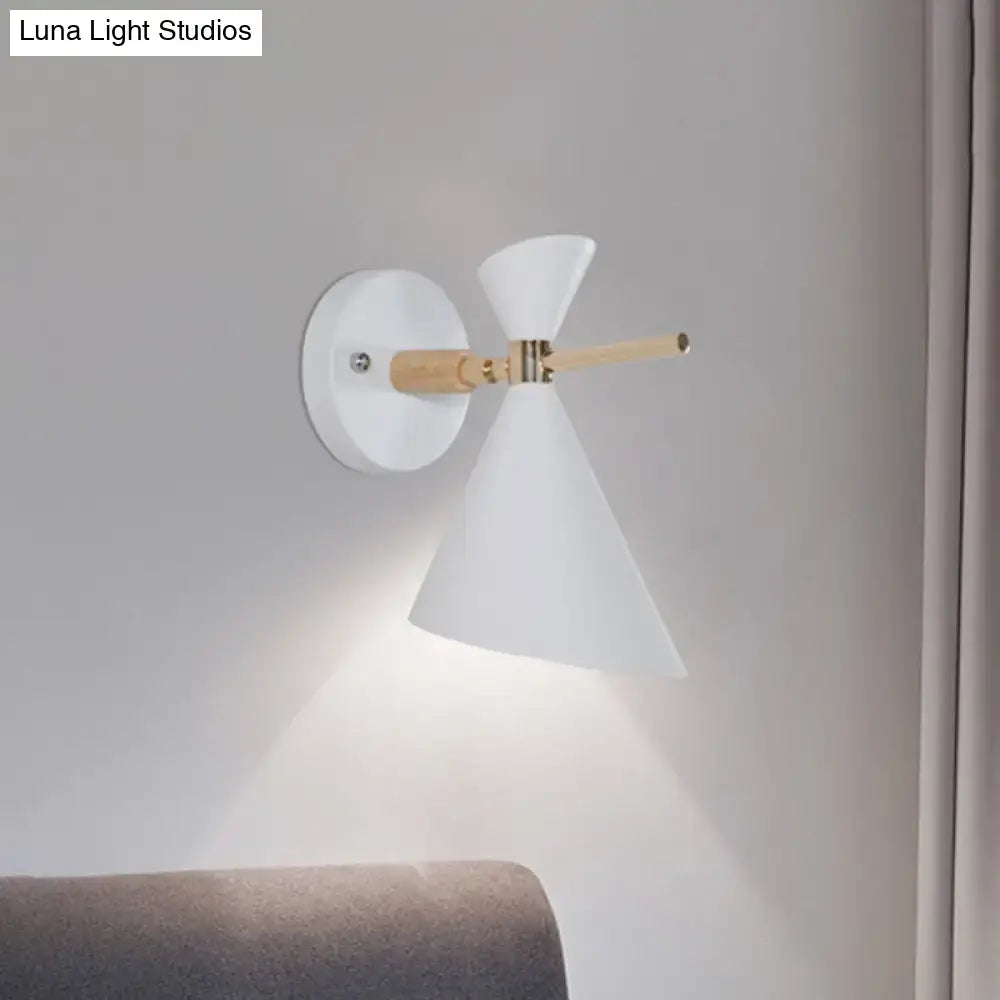 Black angle wall sconce by Decorbites with white conical shade, wood arm and brass accents on Tampa Home & Garden Store