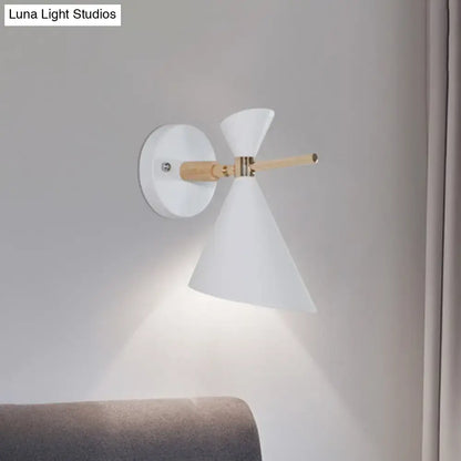 Black angle wall sconce by Decorbites with white conical shade, wood arm and brass accents on Tampa Home & Garden Store