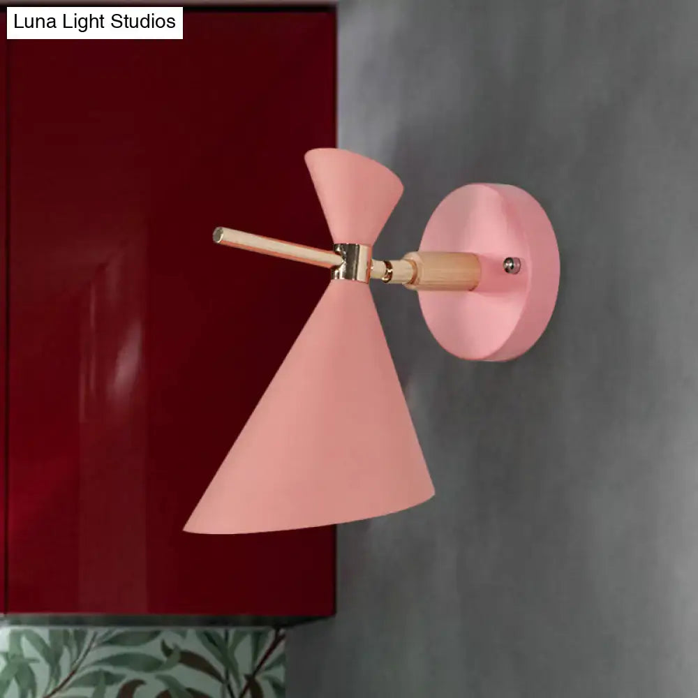 Black angle wall sconce with pink conical shade and wooden arm by Decorbites on Tampa Home & Garden Store
