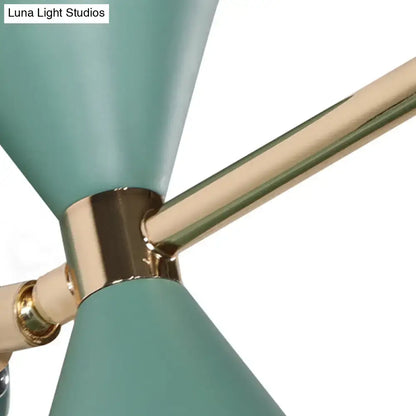 Black angle wall sconce with teal shade cones and brass hardware on Tampa Home & Garden Store