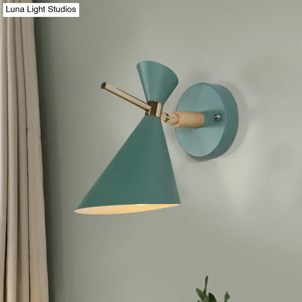 Decorbites black angle wall sconce with teal conical shade, brass arm and round teal wall mount on Tampa Home & Garden Store