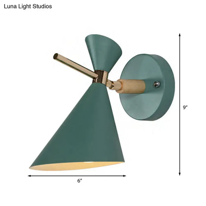 Black angle wall sconce with teal cone shade and brass hardware on round wall mount on Tampa Home & Garden Store
