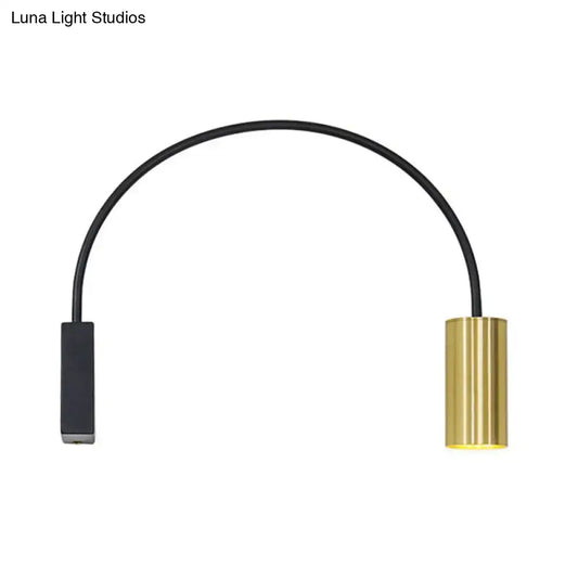 Black arched LED wall light with a gold cylindrical end cap on Tampa Home & Garden Store