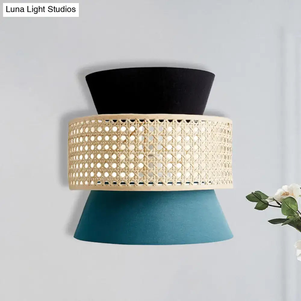 Blue rattan wall sconce by Decorbites with black top and teal conical base on Tampa Home & Garden Store
