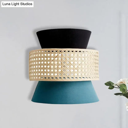 Blue rattan wall sconce by Decorbites with black top and teal conical base on Tampa Home & Garden Store