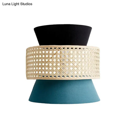Blue rattan wall sconce with beige woven band and teal cone base by Decorbites on Tampa Home & Garden Store