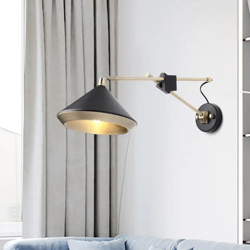 Black brass arm wall sconce with conical black shade and gold interior Decorbites on Tampa Home & Garden Store