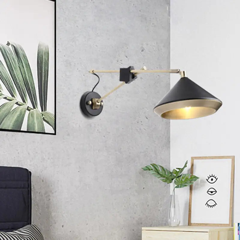 Black brass arm wall sconce with black shade and brass accents Decorbites on Tampa Home & Garden Store