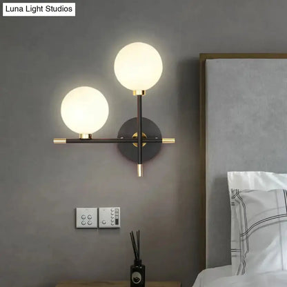 Modern Black and Brass Glass Ball Bedside Sconce