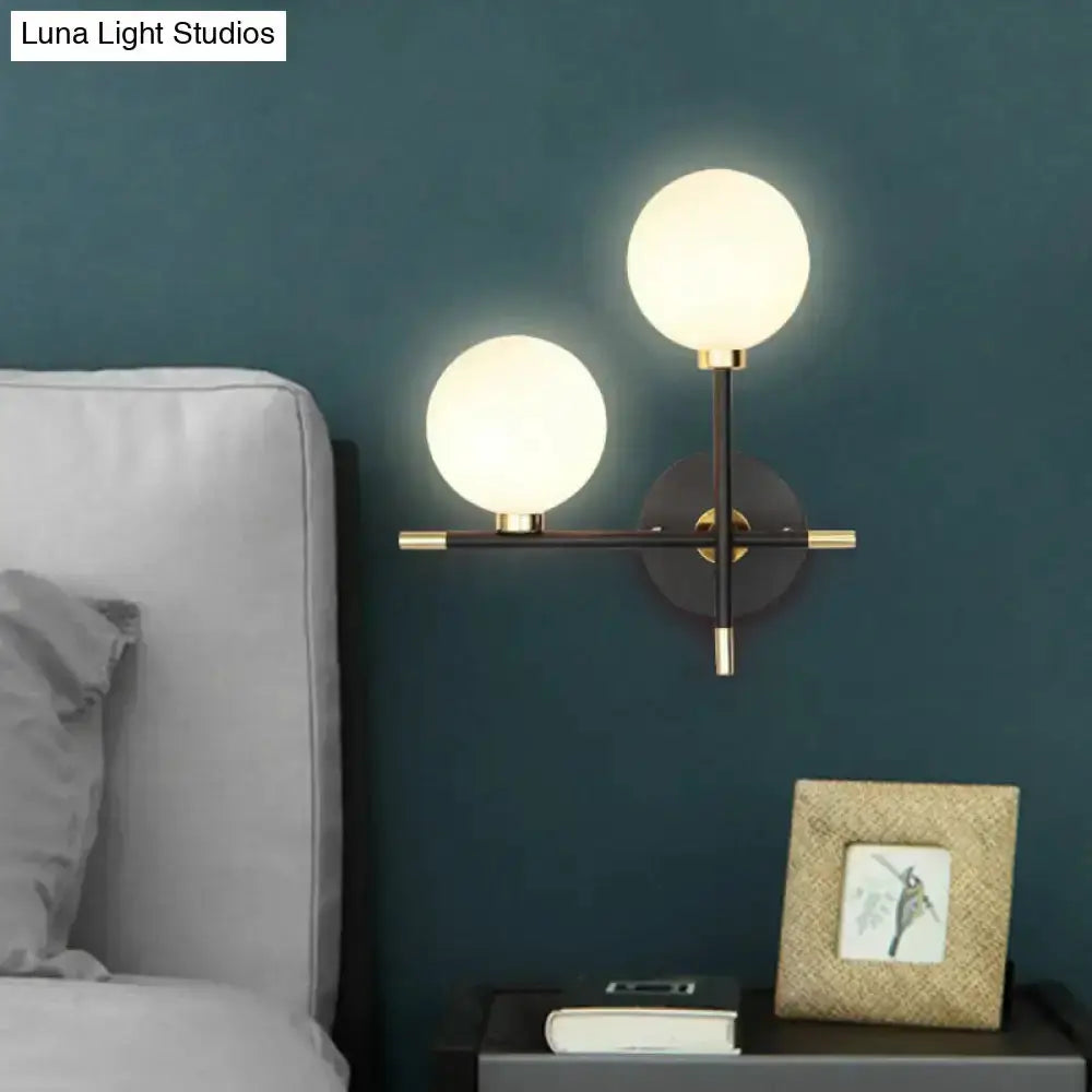 Modern Black and Brass Glass Ball Bedside Sconce