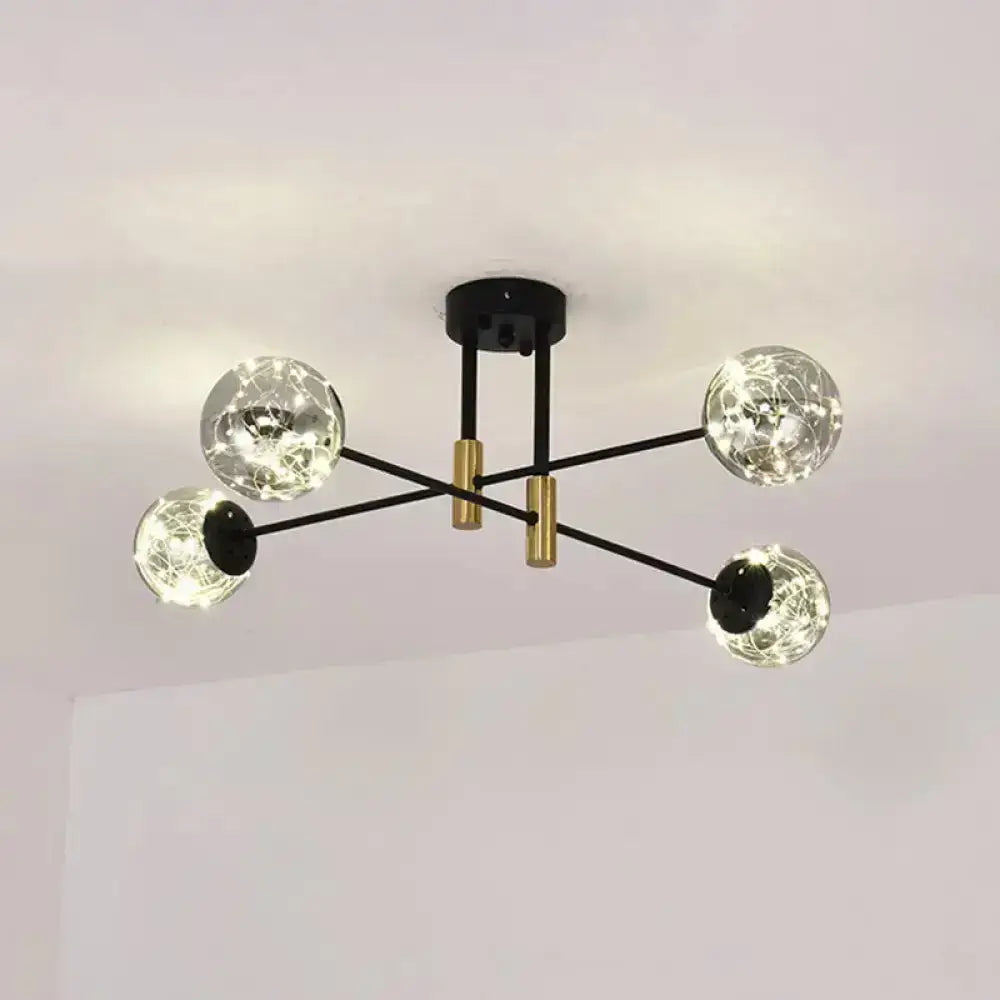 Black brass ball light fixture with four glass globe bulbs by Decorbites on Tampa Home & Garden Store