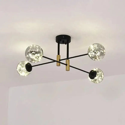 Black brass ball light fixture with four glass globe bulbs by Decorbites on Tampa Home & Garden Store