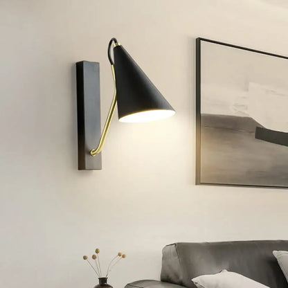 Black brass tapered sconce by Decorbites; wall-mounted lighting on Tampa Home & Garden Store