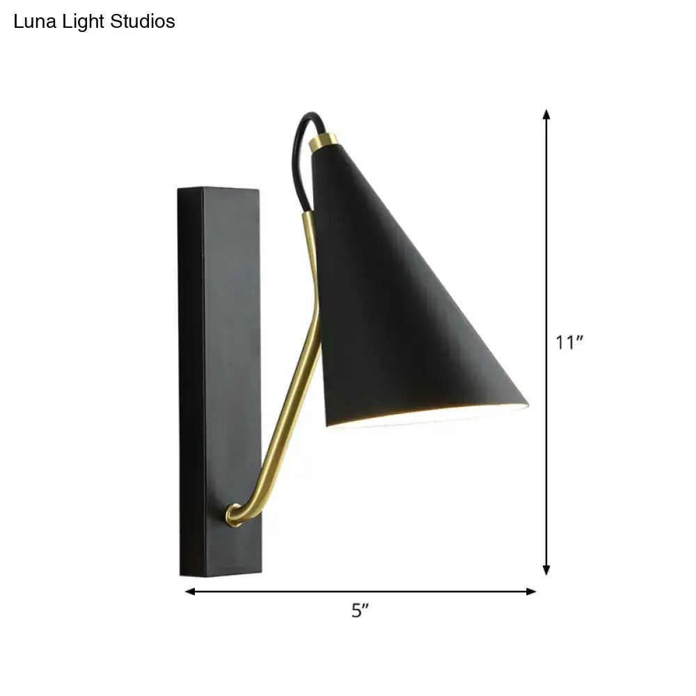 Black brass tapered wall sconce with curved brass arm and conical shade, 11in tall, 5in wide on Tampa Home & Garden Store