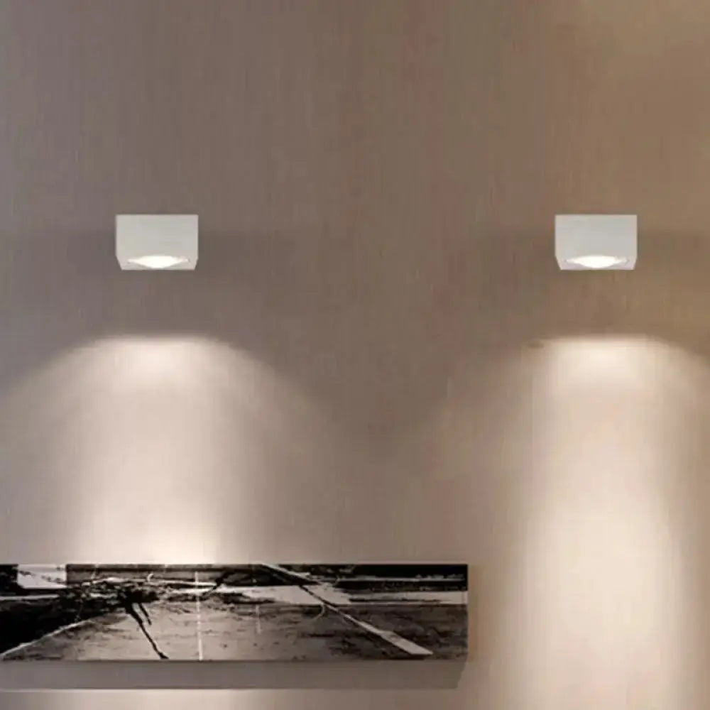 Decorbites rgb wall light pair, square LED sconces on beige wall casting downward glow on Tampa Home & Garden Store