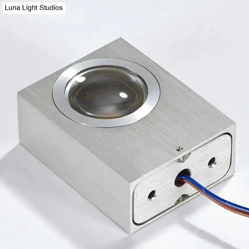 Modern RGB wall light fixture in brushed silver with a round lens and exposed wiring on Tampa Home & Garden Store