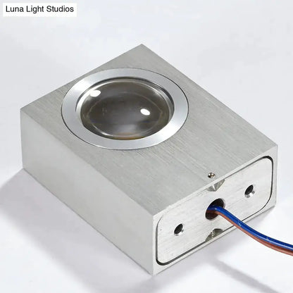 Modern RGB wall light fixture in brushed silver with a round lens and exposed wiring on Tampa Home & Garden Store