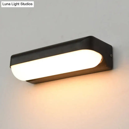 Black capsule flush mount wall sconce by Decorbites, metal housing with white shade on Tampa Home & Garden Store