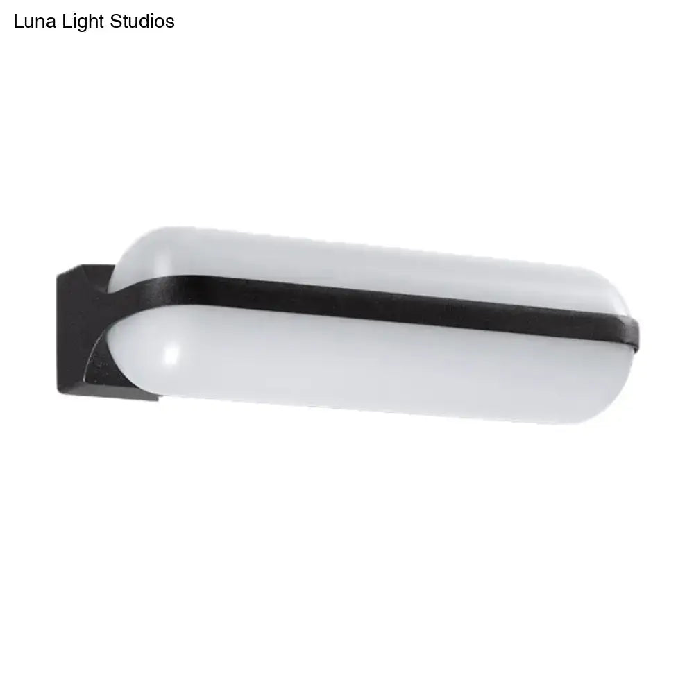 Black capsule flush mount wall sconce with white glass shade by Decorbites on Tampa Home & Garden Store